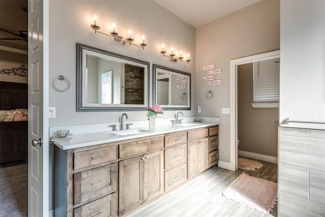 3910 Sienna Rdg, Newcastle, OK 73065 - full bath with double vanity, toilet, baseboards, and a sink