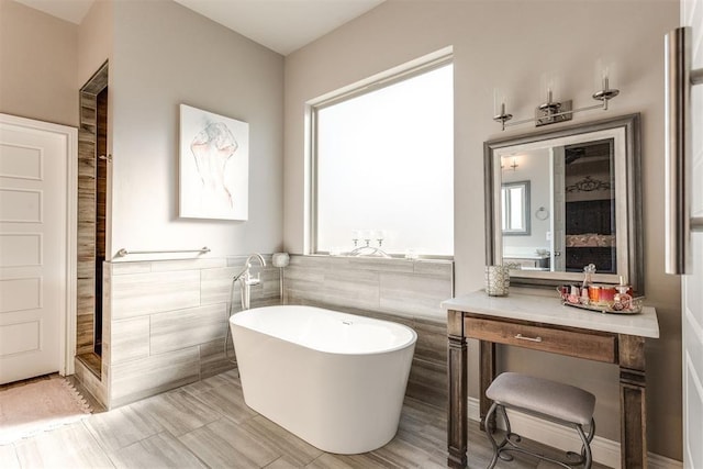 3910 Sienna Rdg, Newcastle, OK 73065 - bathroom with a freestanding tub, a shower, and tile walls