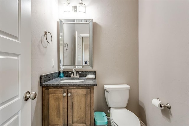 3910 Sienna Rdg, Newcastle, OK 73065 - bathroom featuring a textured wall, toilet, and vanity