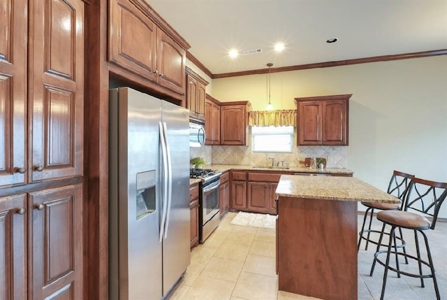 kitchen with a center island, a breakfast bar, sink, tasteful backsplash, and appliances with stainless steel finishes