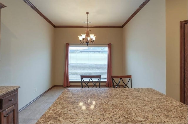 dining area featuring crown molding and a chandelier