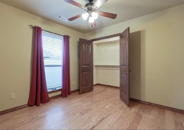 unfurnished bedroom with light wood-type flooring and ceiling fan