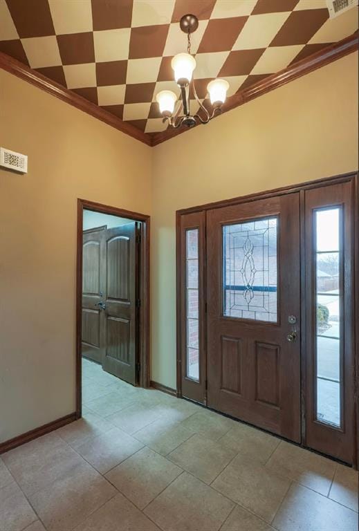 entrance foyer with crown molding, a notable chandelier, and a towering ceiling