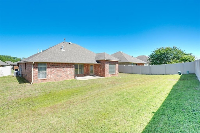 2016 Lantana Cir, Shawnee, OK 74804 - back of property featuring a patio, brick siding, a shingled roof, and central air condition unit
