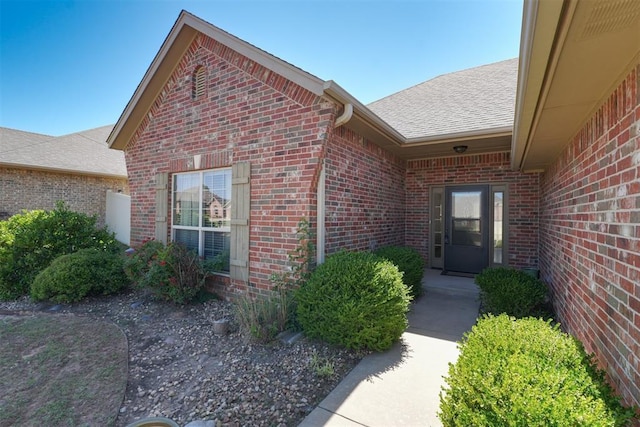 2016 Lantana Cir, Shawnee, OK 74804 - entrance to property featuring brick siding and a shingled roof