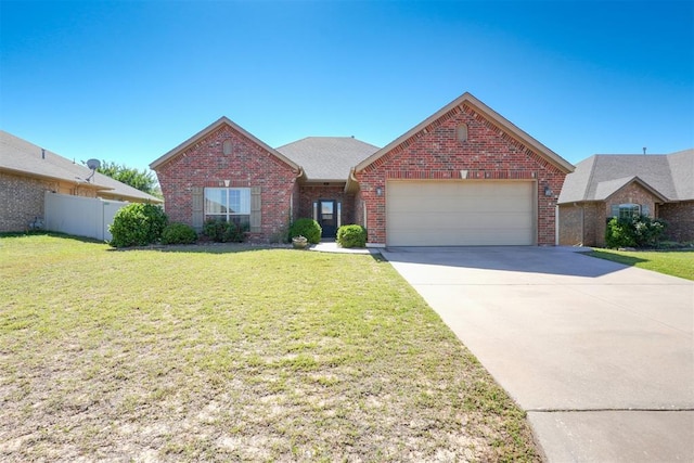 2016 Lantana Cir, Shawnee, OK 74804 - view of front facade with brick siding, an attached garage, and concrete driveway