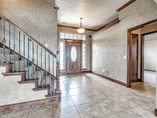 tiled foyer with crown molding