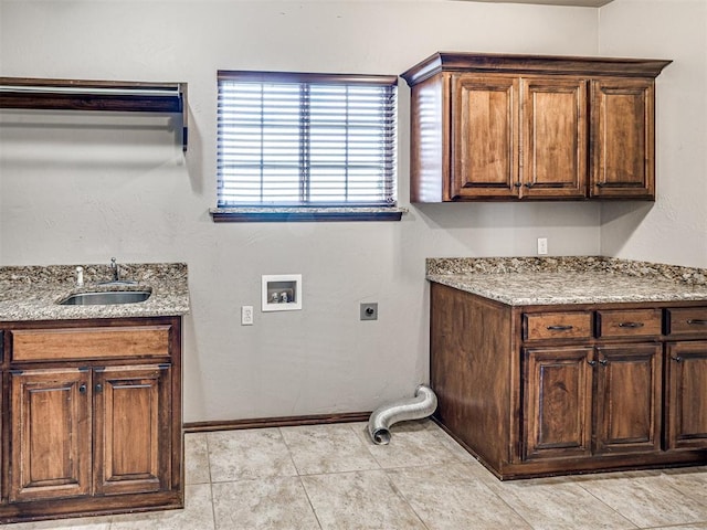 clothes washing area featuring washer hookup, light tile patterned floors, sink, cabinets, and electric dryer hookup