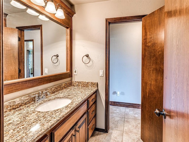 bathroom featuring tile patterned flooring and vanity