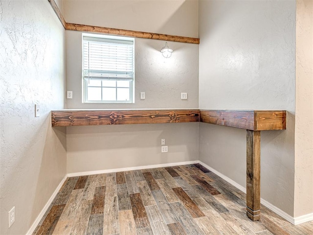 empty room featuring hardwood / wood-style flooring