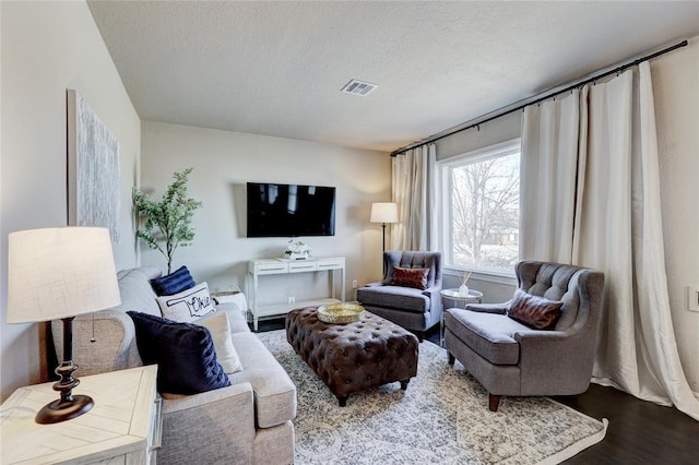 414 NW 50th St, Oklahoma City, OK 73118 - living area featuring dark wood-style flooring and a textured ceiling