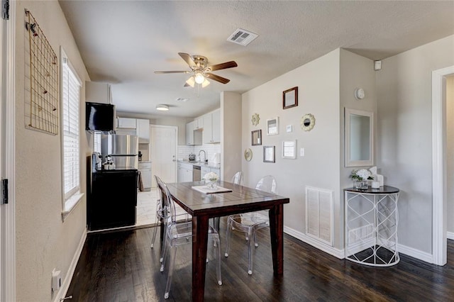 414 NW 50th St, Oklahoma City, OK 73118 - dining room with ceiling fan, dark wood-type flooring, and baseboards