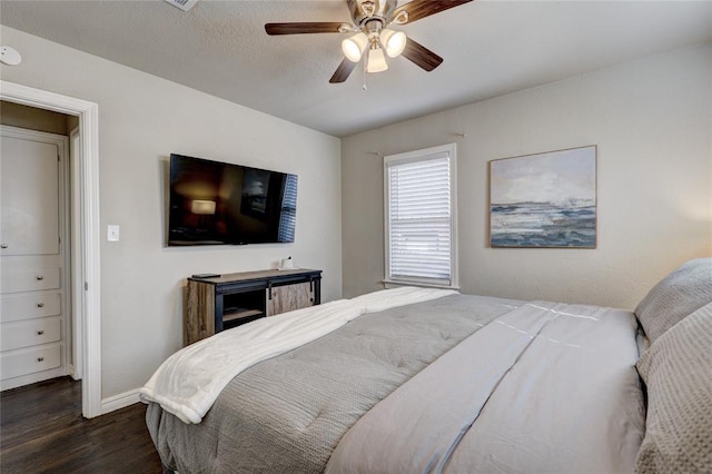 414 NW 50th St, Oklahoma City, OK 73118 - bedroom featuring dark wood-style flooring, baseboards, and a ceiling fan