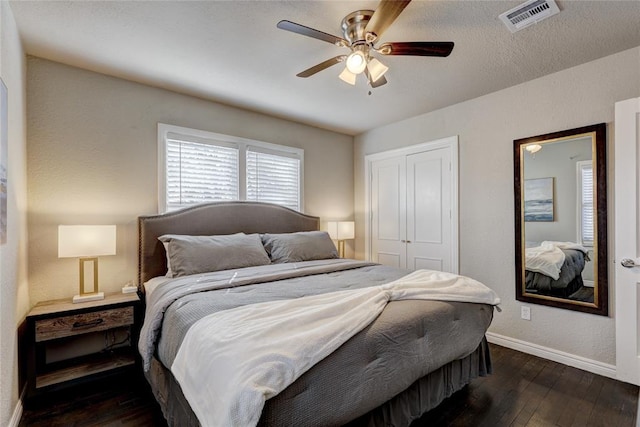 414 NW 50th St, Oklahoma City, OK 73118 - bedroom featuring dark wood-style floors, a closet, baseboards, and ceiling fan