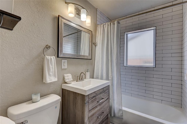 414 NW 50th St, Oklahoma City, OK 73118 - bathroom with toilet, a textured wall, shower / bath combo with shower curtain, and vanity