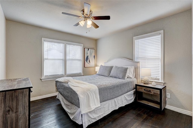 414 NW 50th St, Oklahoma City, OK 73118 - bedroom featuring baseboards, dark wood-type flooring, and a ceiling fan