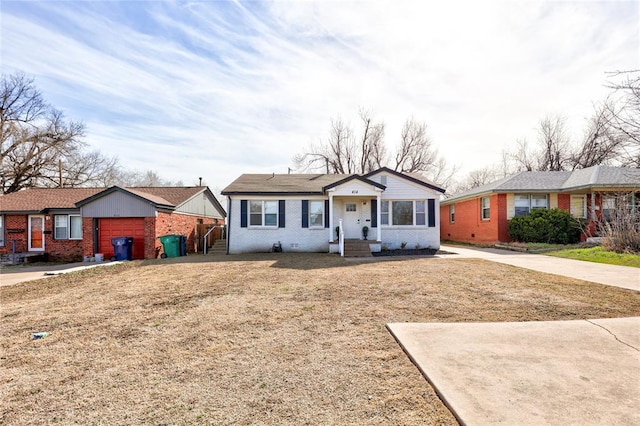 414 NW 50th St, Oklahoma City, OK 73118 - bungalow-style house featuring brick siding, a garage, and concrete driveway