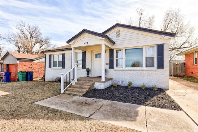 414 NW 50th St, Oklahoma City, OK 73118 - bungalow-style home with crawl space, brick siding, and fence