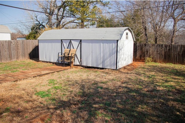 view of shed featuring a fenced backyard