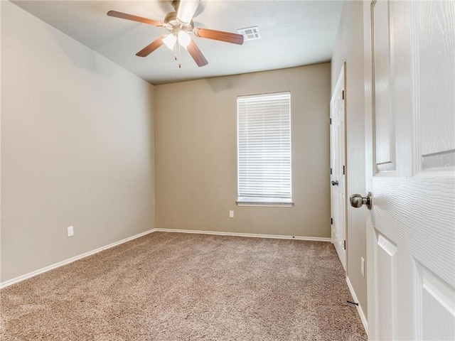 unfurnished room featuring ceiling fan and carpet flooring