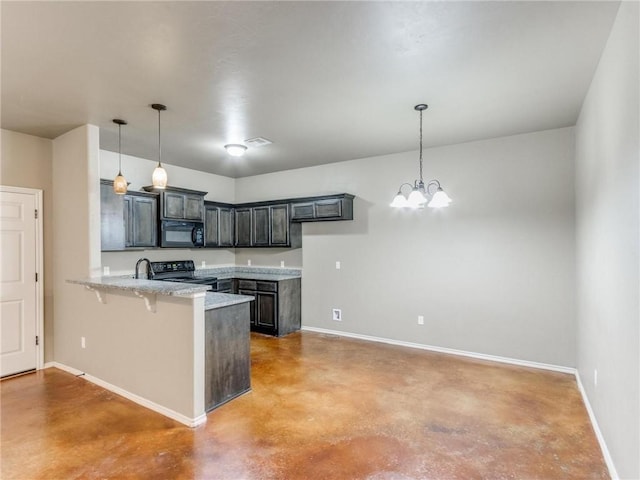 kitchen with kitchen peninsula, black appliances, a kitchen bar, and pendant lighting