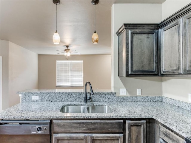 kitchen featuring hanging light fixtures, black dishwasher, sink, dark brown cabinets, and ceiling fan