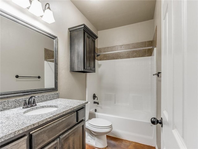 full bathroom with toilet, vanity, and shower / bathtub combination