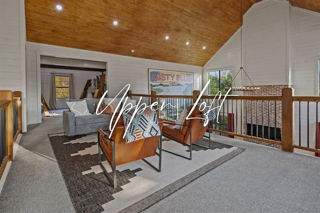 interior space featuring high vaulted ceiling, wood walls, carpet flooring, and wood ceiling