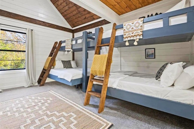 bedroom featuring lofted ceiling with beams, wood walls, wood ceiling, and carpet flooring