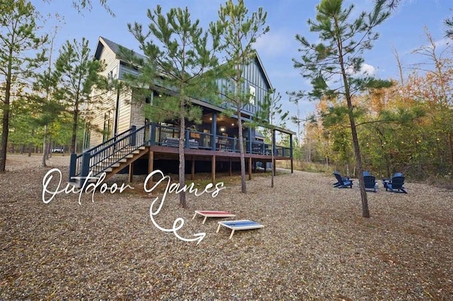 view of playground featuring stairway and a deck