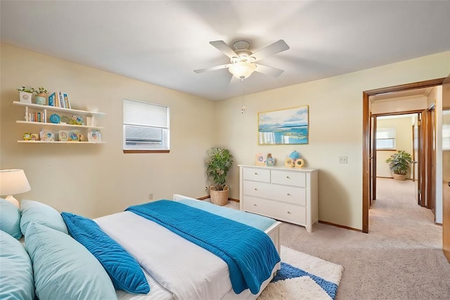 bedroom with light colored carpet and ceiling fan