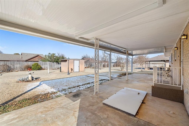 view of patio with a storage shed