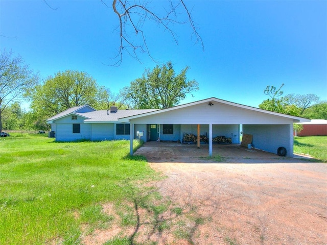 17826 240th St, Washington, OK 73093 - view of front of house with dirt driveway, a front lawn, and a carport