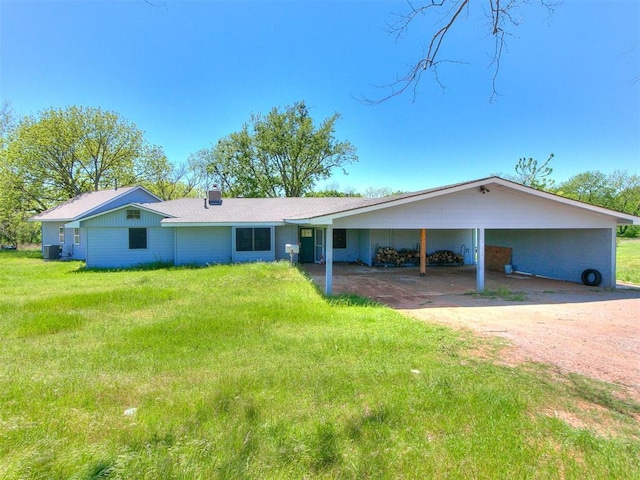 17826 240th St, Washington, OK 73093 - ranch-style house with a front lawn, driveway, a carport, a chimney, and central AC
