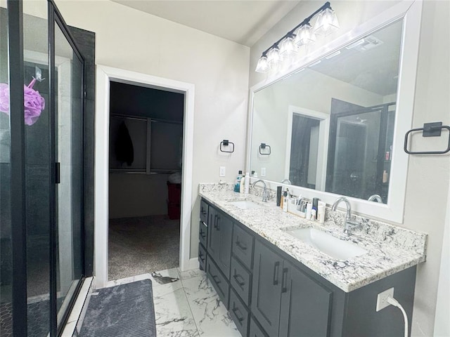 bathroom with vanity and an enclosed shower