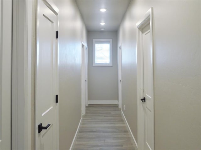 hallway with light wood-type flooring