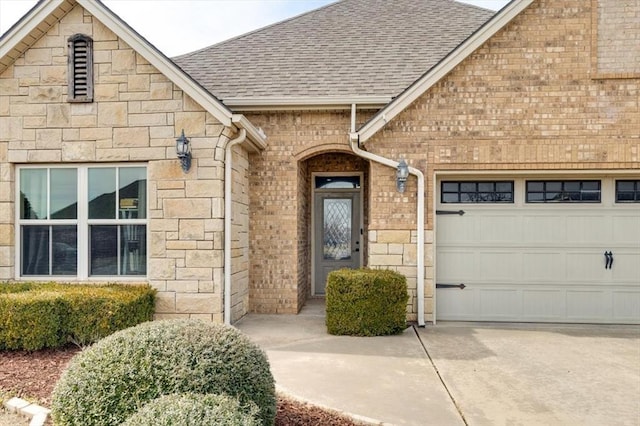 view of exterior entry featuring a garage