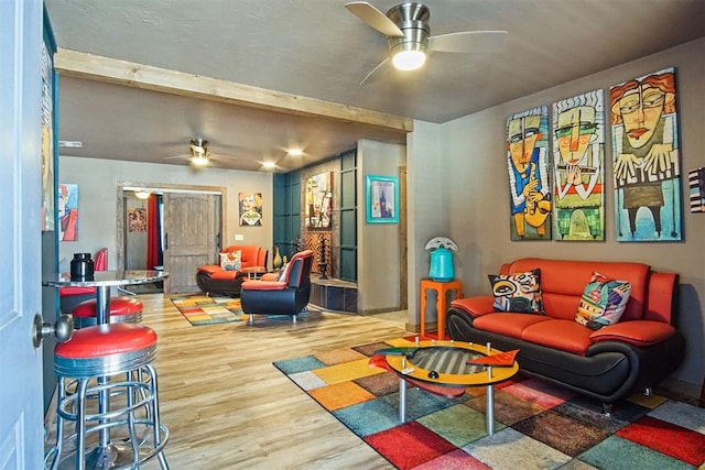 recreation room featuring a ceiling fan and wood finished floors