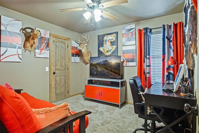 office space with a ceiling fan, carpet, and baseboards