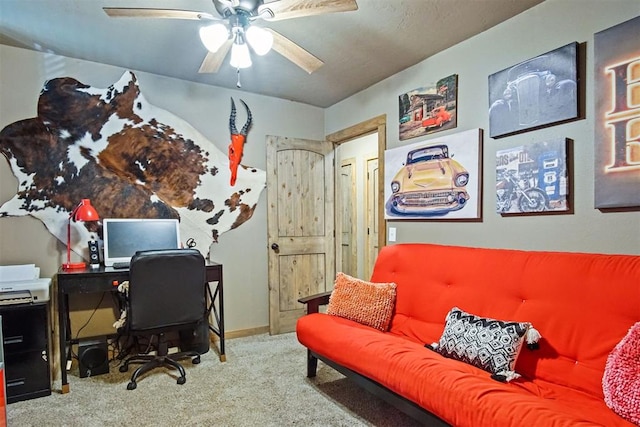 home office featuring carpet, baseboards, and ceiling fan