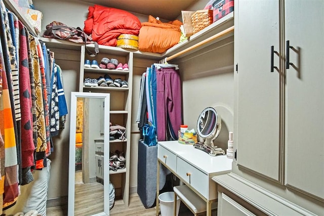 walk in closet featuring light wood finished floors