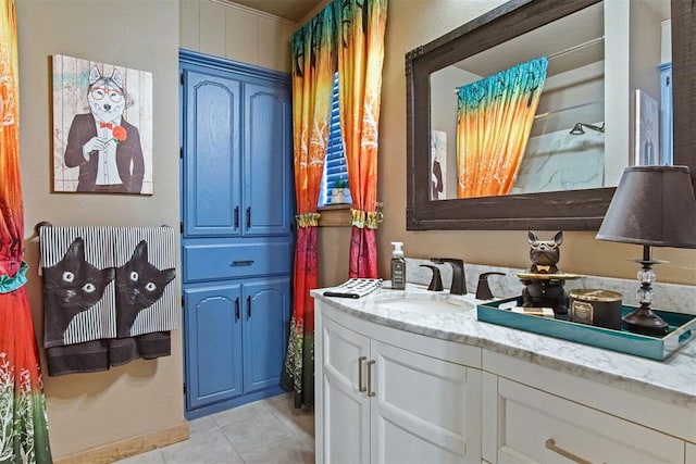 full bathroom with vanity and tile patterned floors