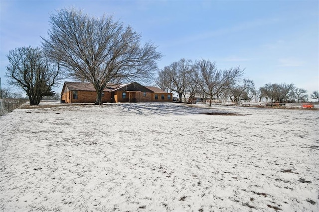 view of yard layered in snow