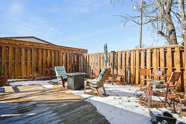 view of snow covered deck