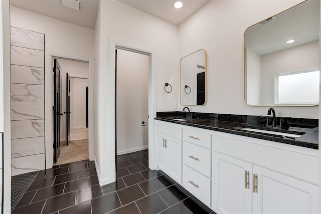 bathroom featuring tile patterned floors and vanity