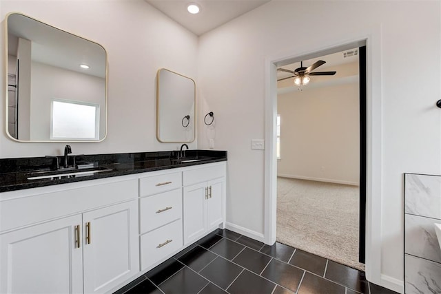 bathroom with ceiling fan, tile patterned flooring, and vanity