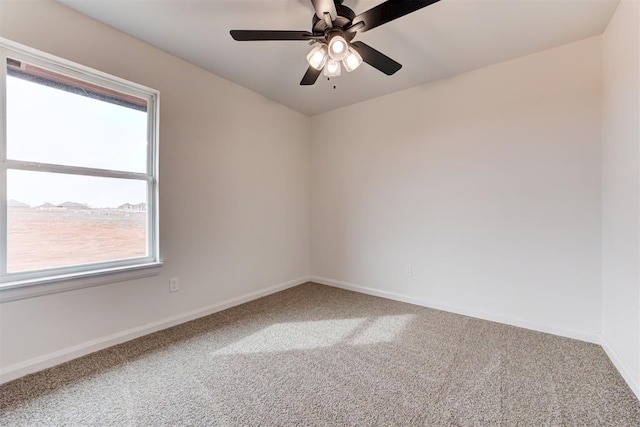 carpeted empty room with ceiling fan