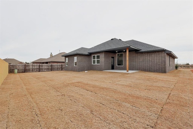 back of property featuring a patio area