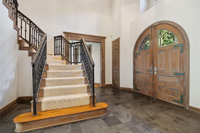 foyer entrance with a high ceiling