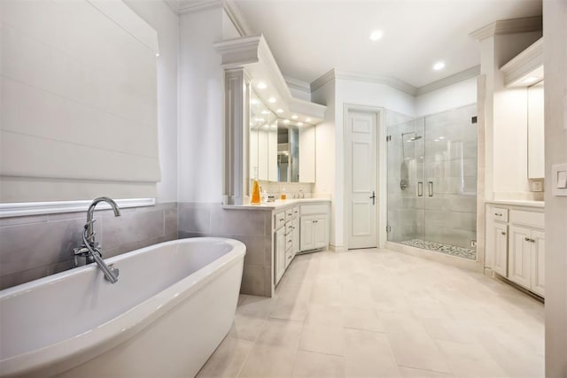 bathroom featuring vanity, shower with separate bathtub, and crown molding